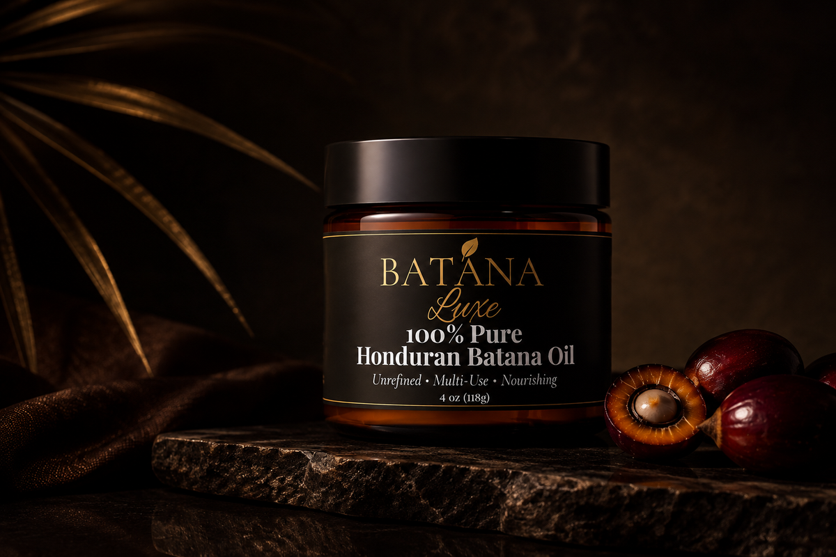 Batana Luxe Batana Oil jar on dark stone with palm fruit